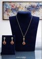 Completo collier e orecchini in argento dorato con corallo
