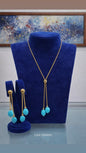 Completo collier e orecchini in argento dorato con pasta di tuchese "4 fiori"