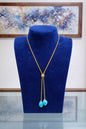 Collier in argento dorato con pasta di turchese "4 fiori"